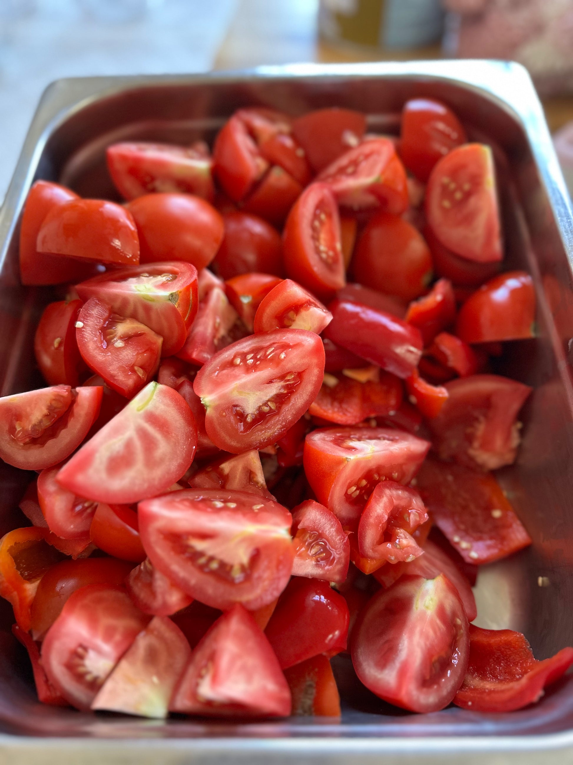 Chopped tomatoes in a metal container
